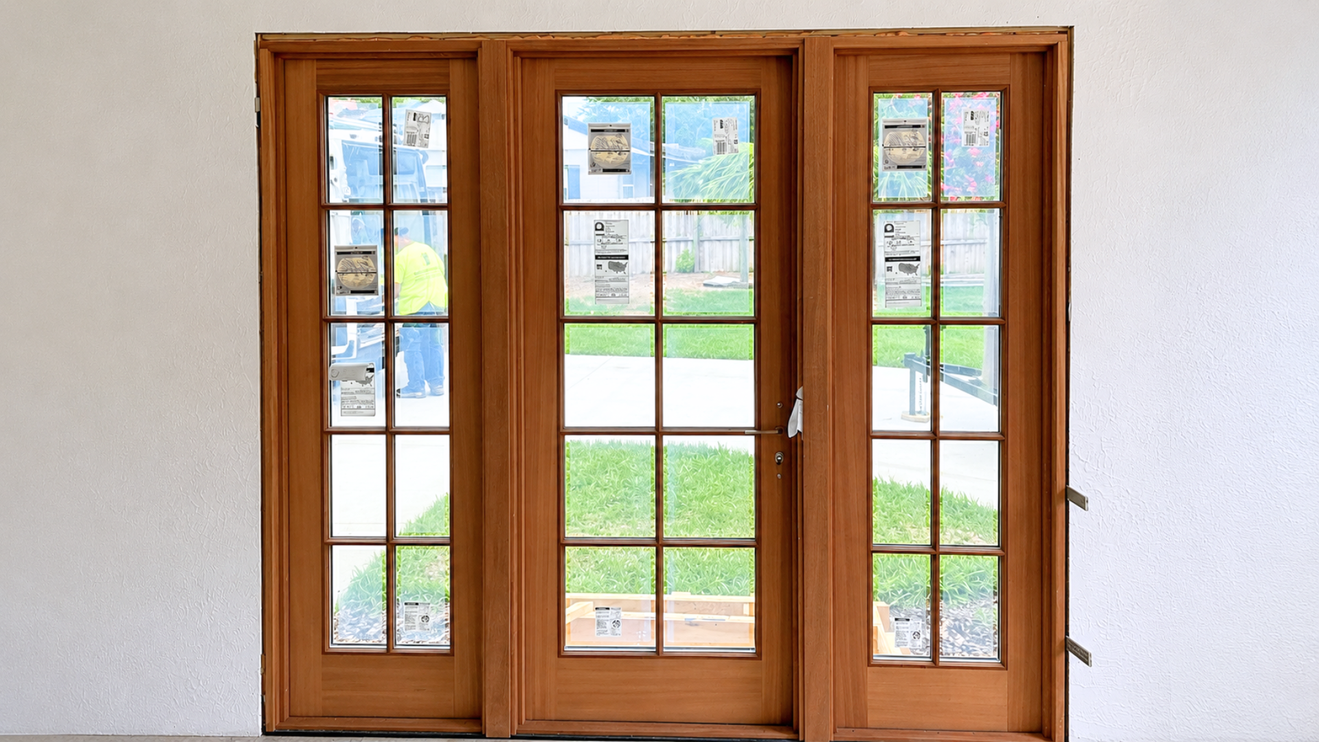 New French doors installed and trimmed, opening the home to the outdoors